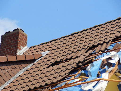 A heavily damaged roof following a storm