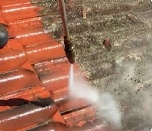 Pressure Cleaning of Metal or Tile Roof: Everything Adelaide Homeowners Should Know 1 Pressure cleaning of a roof in process