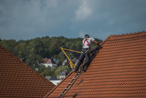 Roofer working on a tile roof